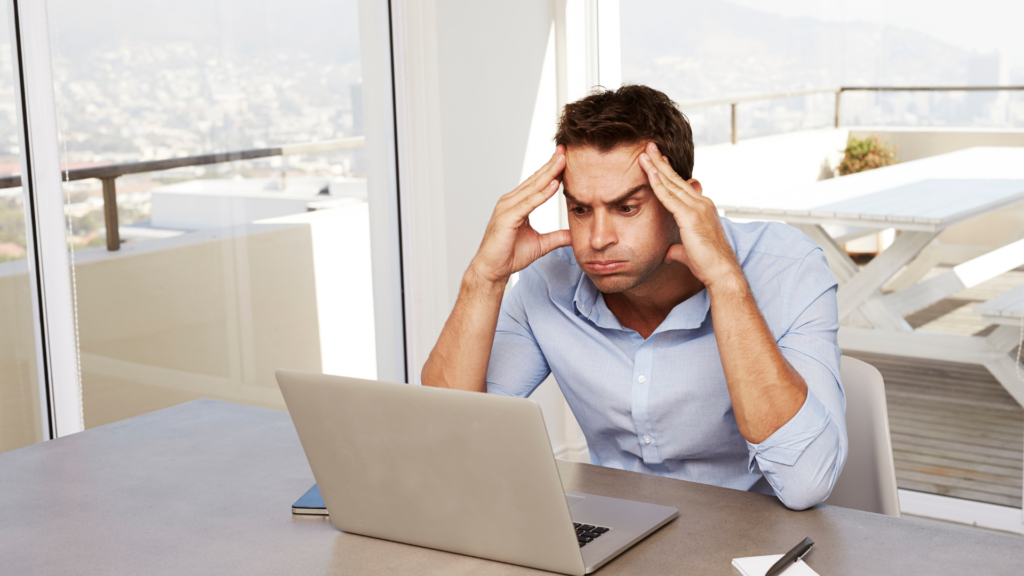 Starting A Business- Is it too late? Frustrated guy looking at computer